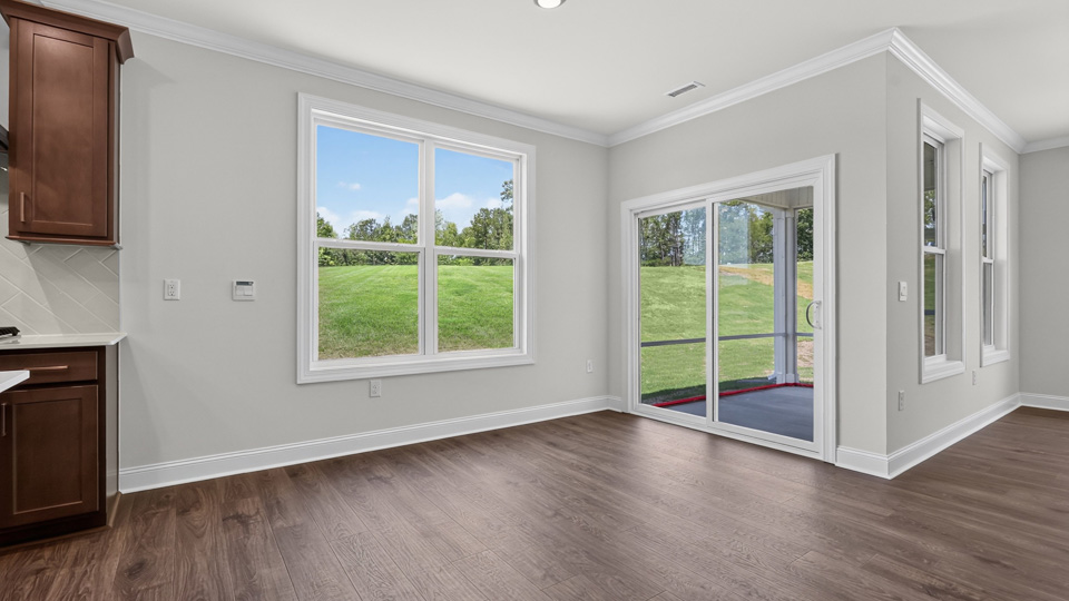 open concept dining space with door to patio