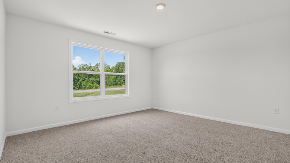 additional bedroom with window, carpeting, closet