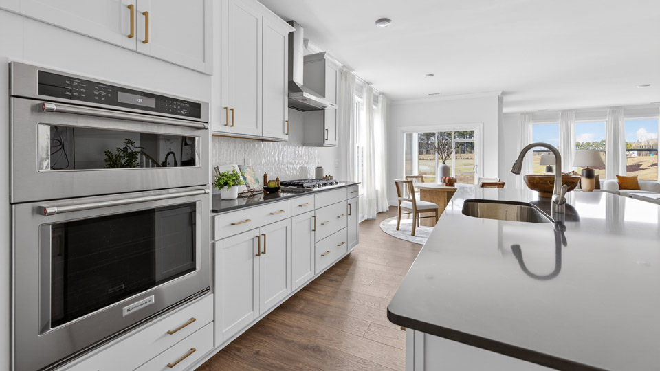 kitchen with stainless steel appliances and white cabinets