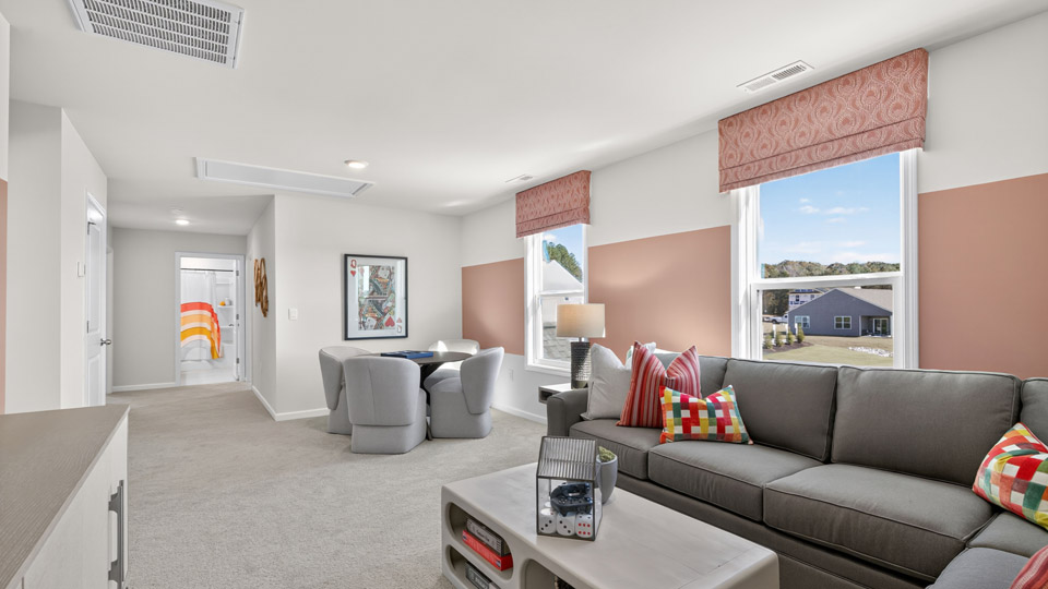 loft with carpet flooring