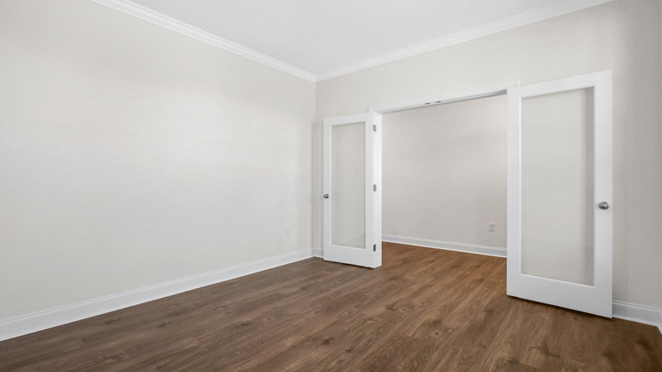 study with french doors and revwood flooring