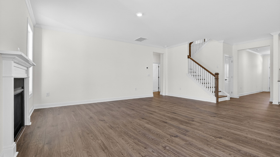 living room with revwood flooring and fireplace