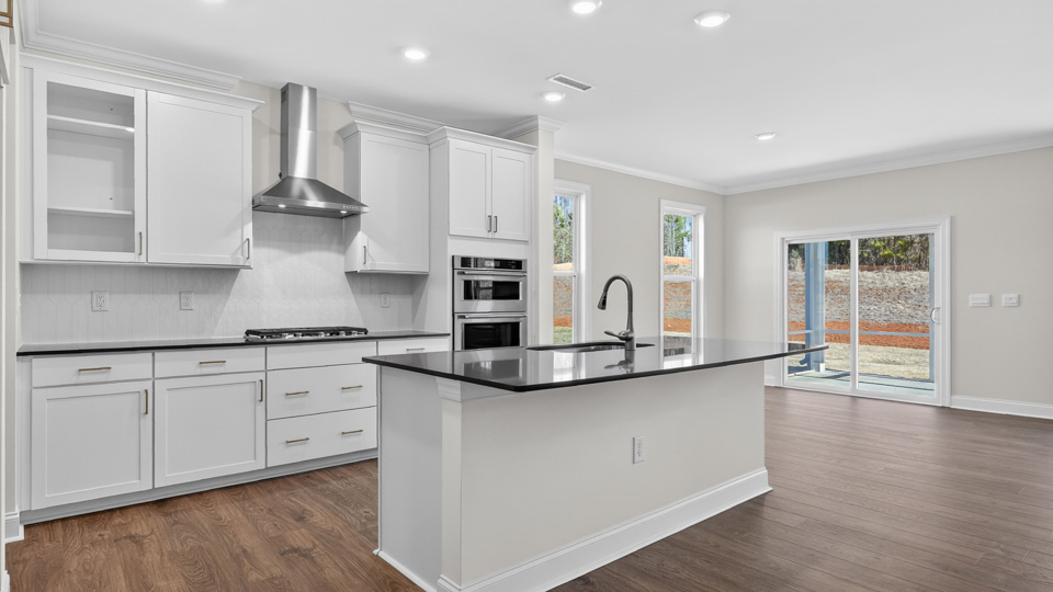 kitchen with island white cabinets and quartz countertops