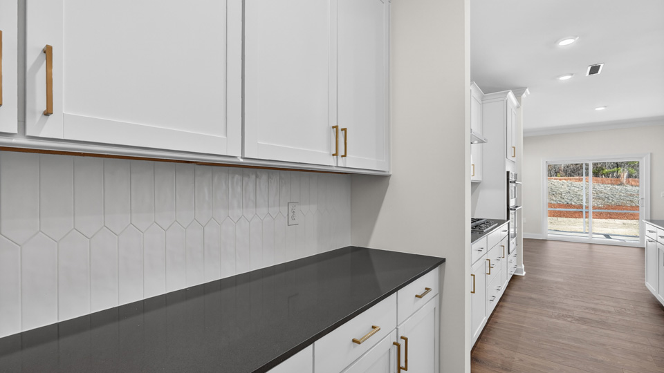 butlers pantry with quartz countertops