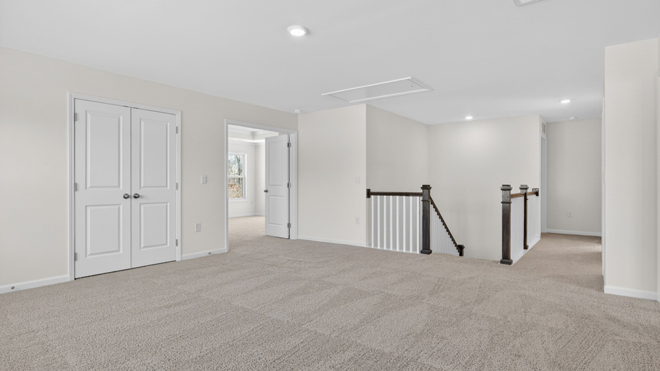 top of stairs at loft with carpet flooring