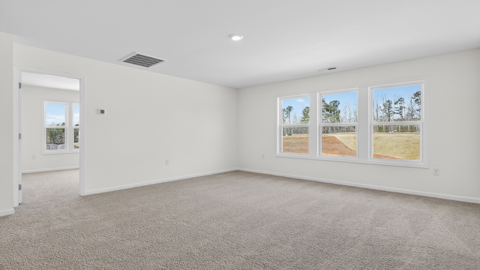 loft with carpet flooring