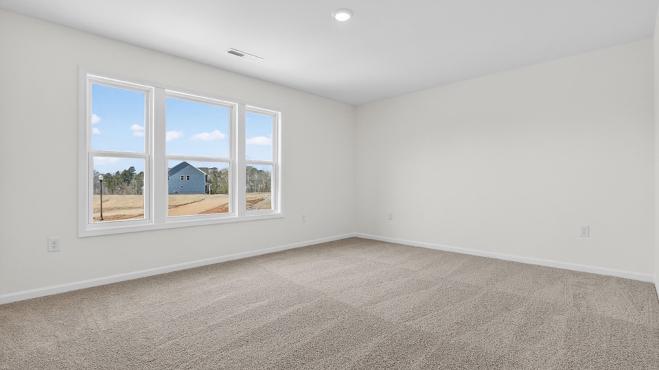 loft with carpet flooring