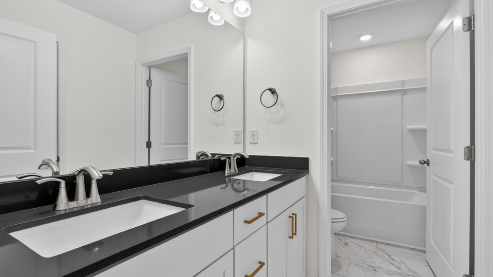 bathroom with tub shower combo