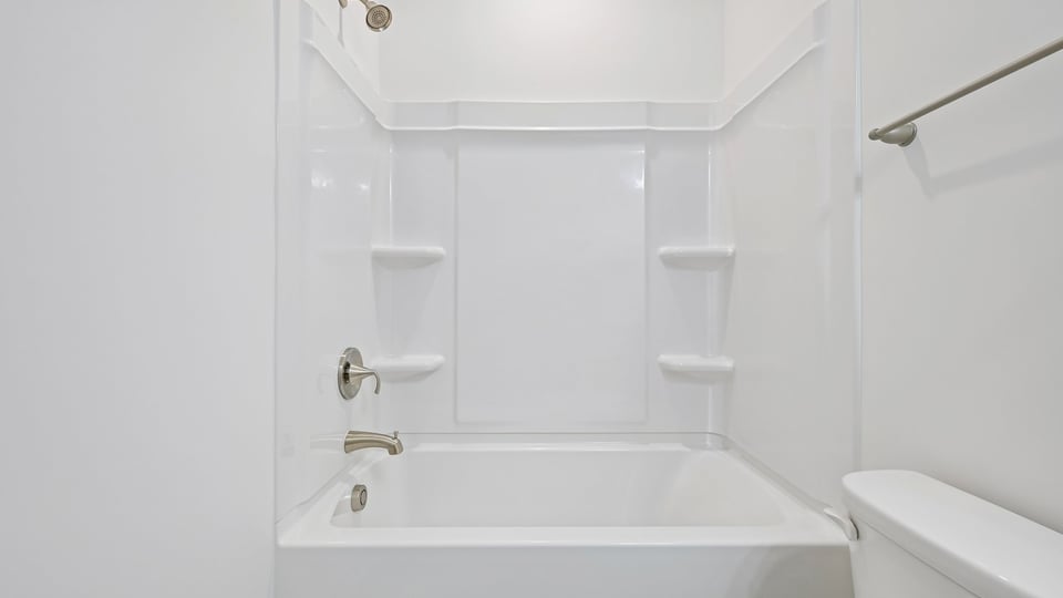 bathroom with tub shower combo