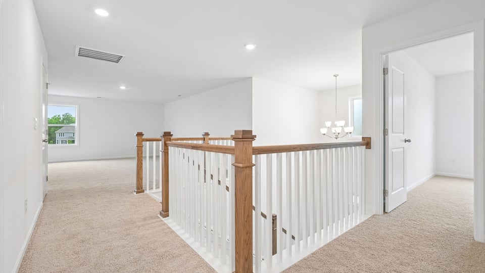 top of stairs at loft with carpet flooring