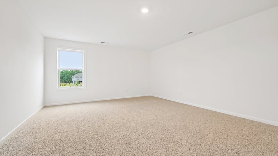 loft with carpet flooring