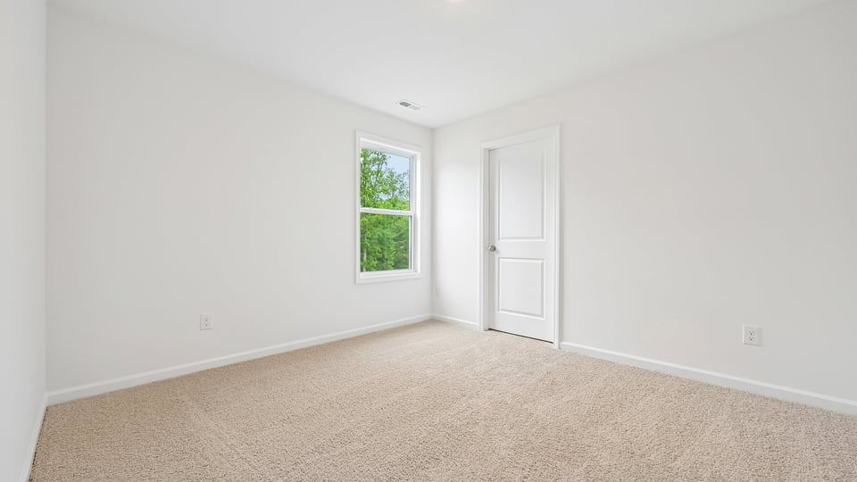 loft with carpet flooring