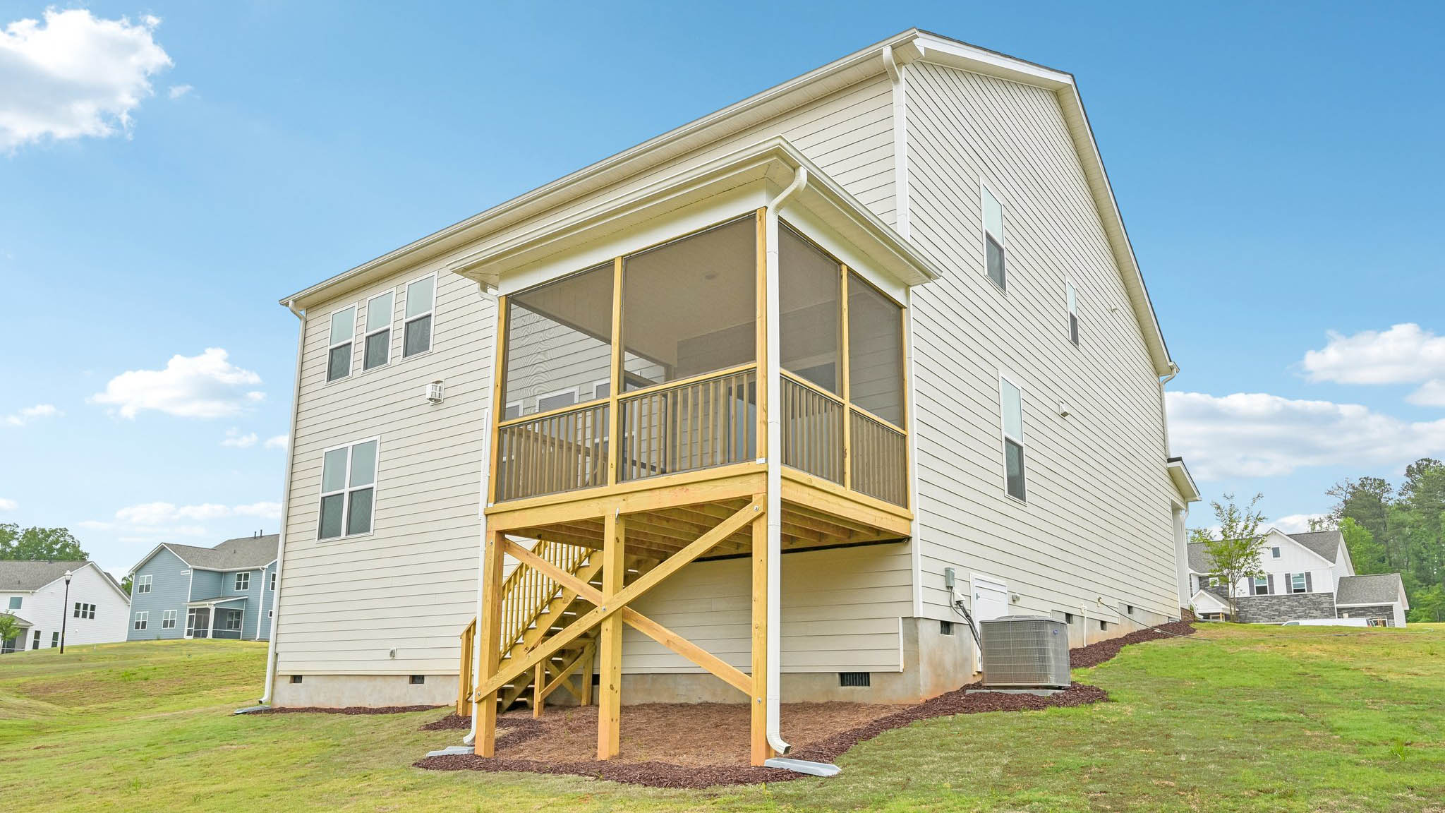 back of home on crawl space with covered and screened back deck