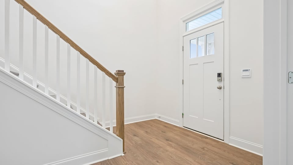 foyer entryway with staircase with open railing