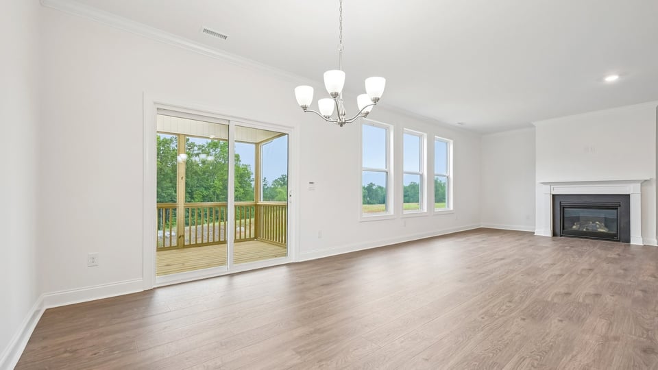 living room with fireplace and sliding glass doors to back deck
