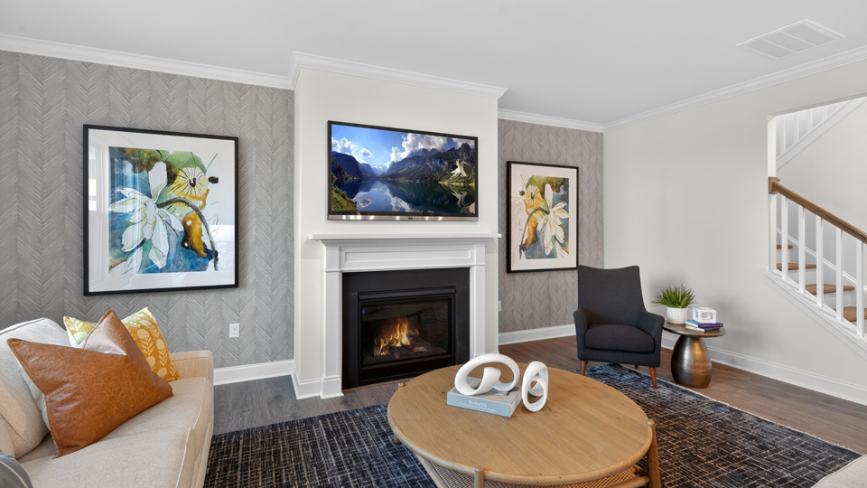 open concept living space with large windows, fireplace