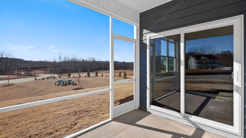 Covered back patio overlooking backyard