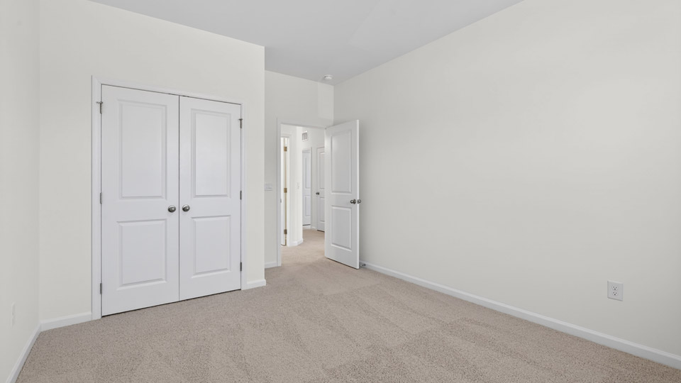 Bedroom with carpet floor and closet