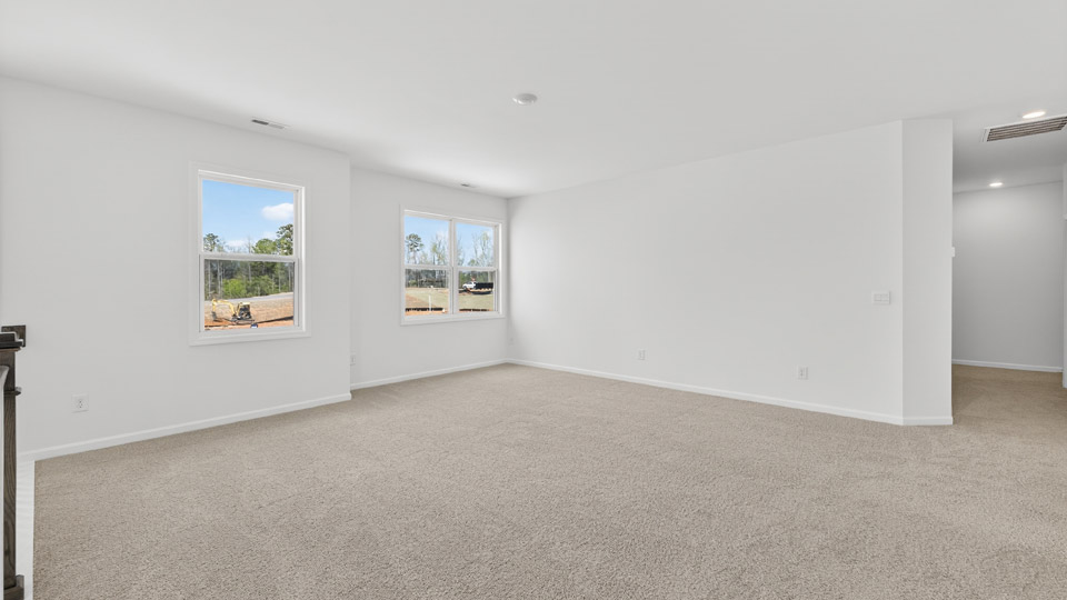 loft with carpet flooring