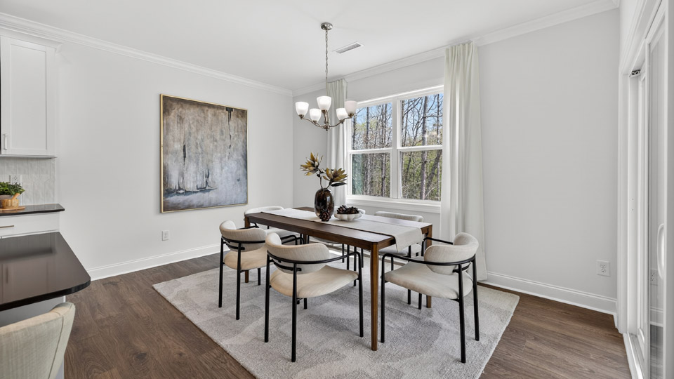 formal dining room with coffered ceilings
