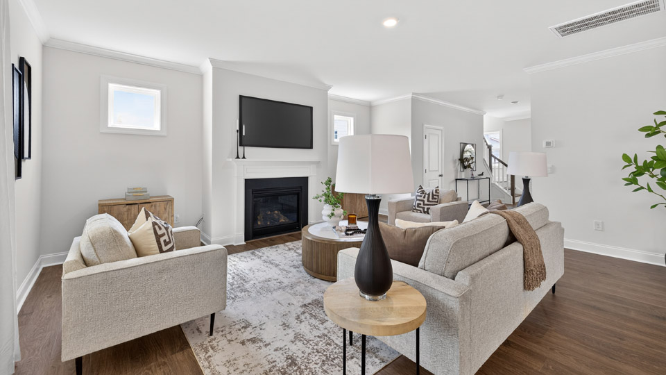 open concept living space with large windows, fireplace