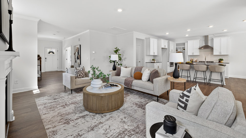 open concept living space with large windows, fireplace