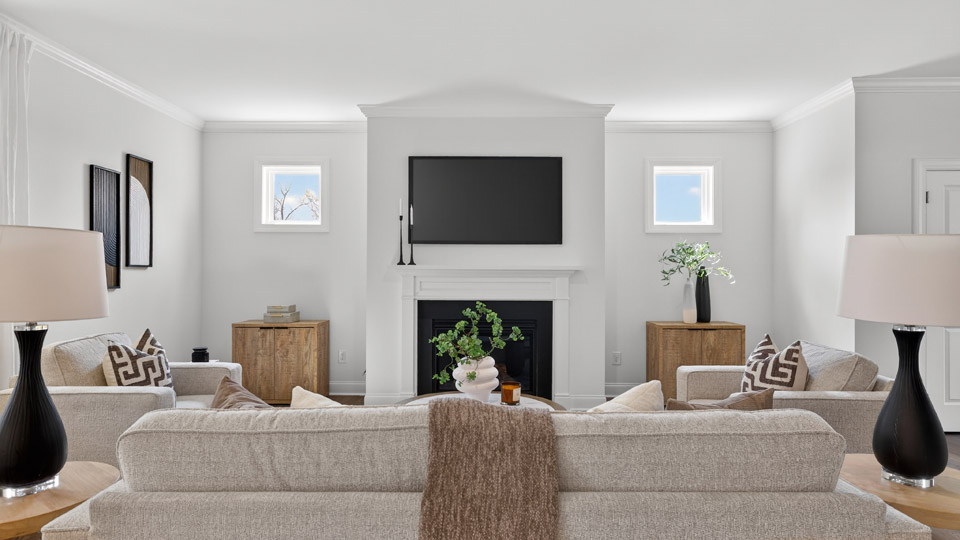open concept living space with large windows, fireplace