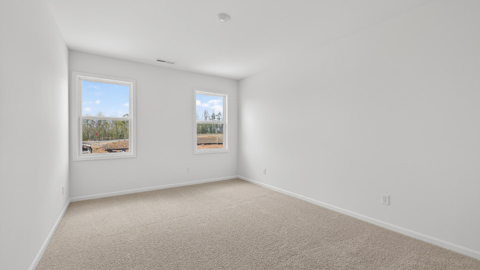 additional bedroom with window, carpeting, closet