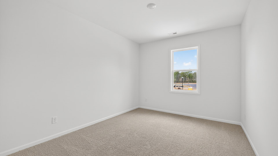 additional bedroom with window, carpeting, closet