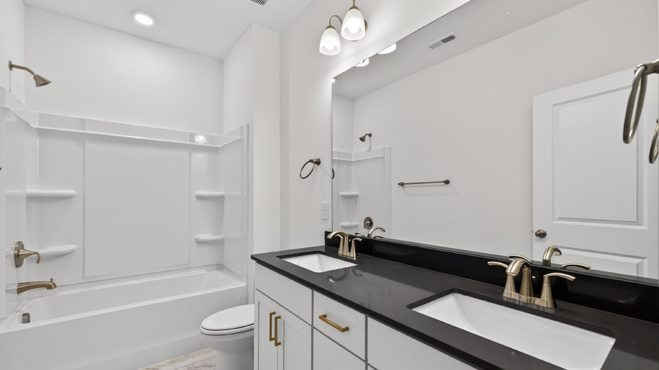 additional bathroom with double vanity sink