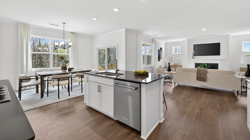 kitchen with quartz counters, kitchen island, pantry, stainless steel appliances