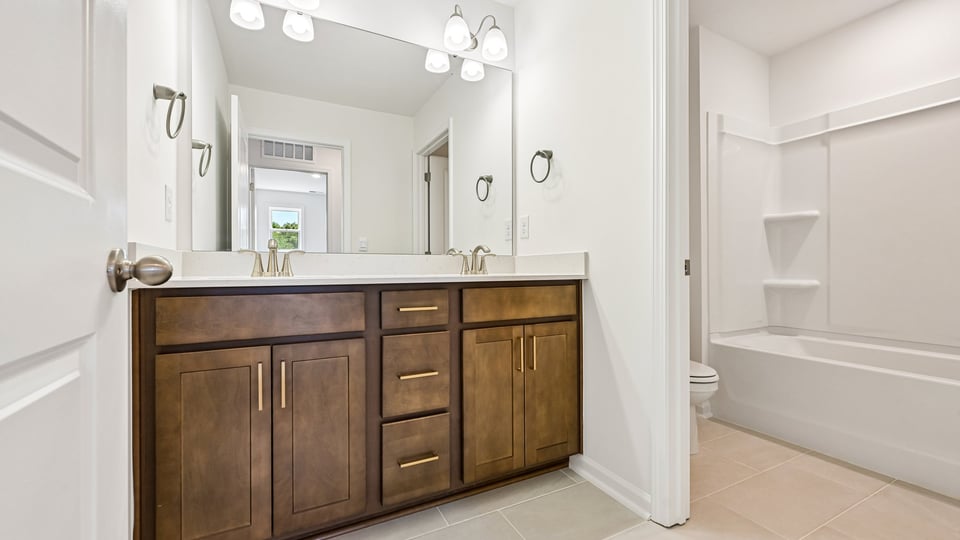 additional bathroom with double vanity sink