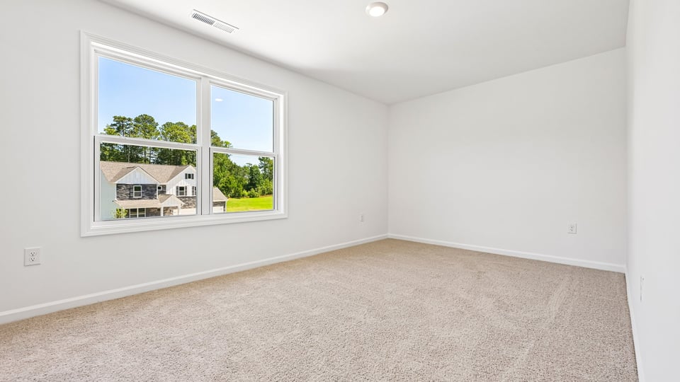 additional bedroom with window, carpeting, closet