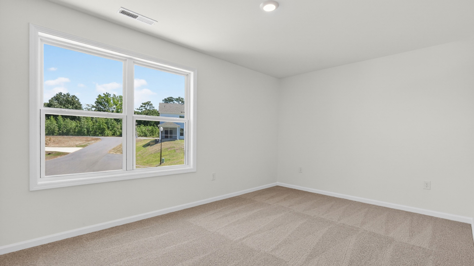 additional bedroom with window, carpeting, closet