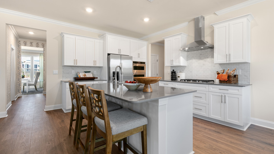 bennett kitchen with white cabinets kitchen island and stainless steel appliances