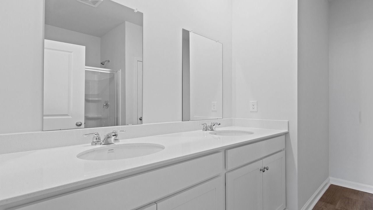 Large primary bathroom with dual vanity