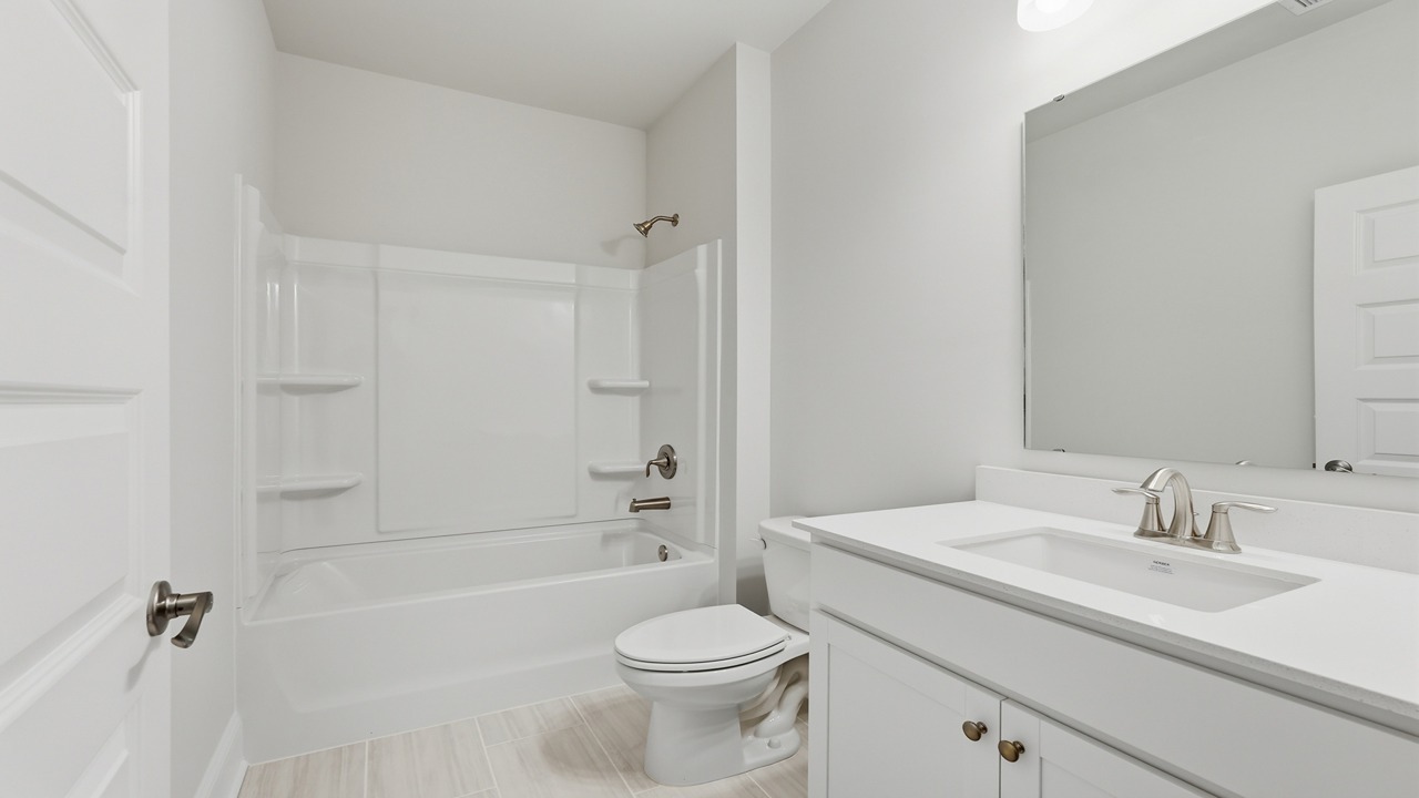 Guest bathroom with a large vanity and tub