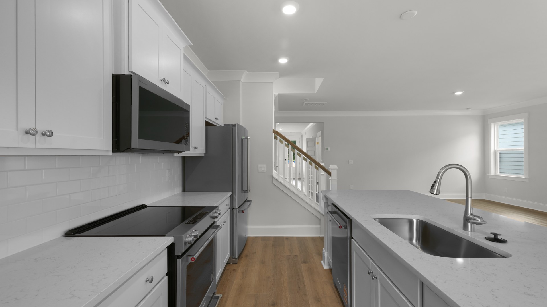 Kitchen with white cabinets and quartz