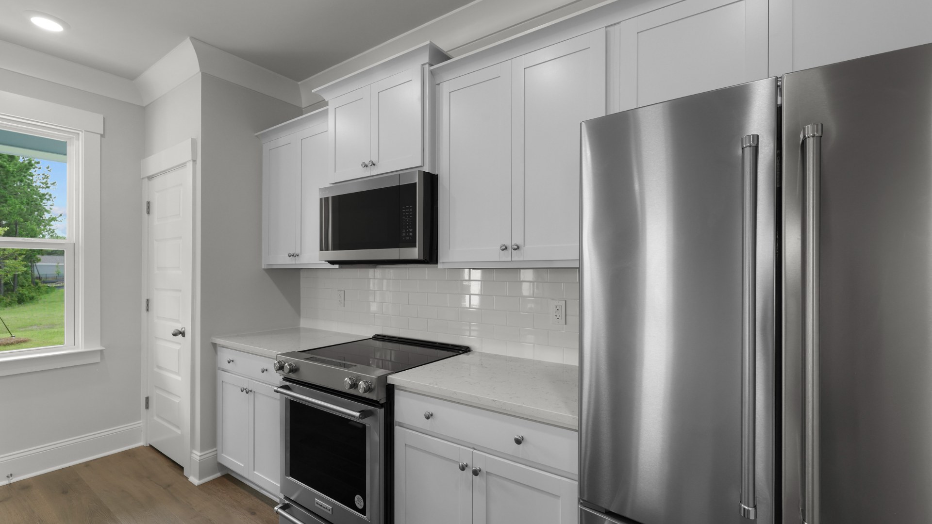 Kitchen with white cabinets and quartz