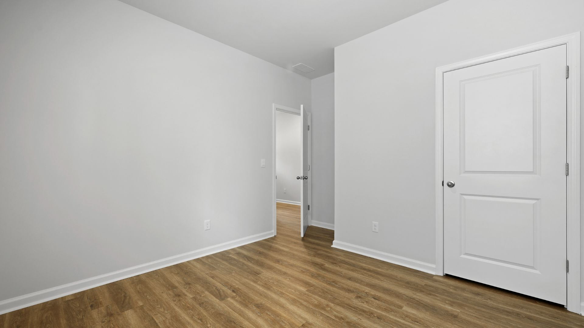 Closet is spacious and room has natural lighting from windows