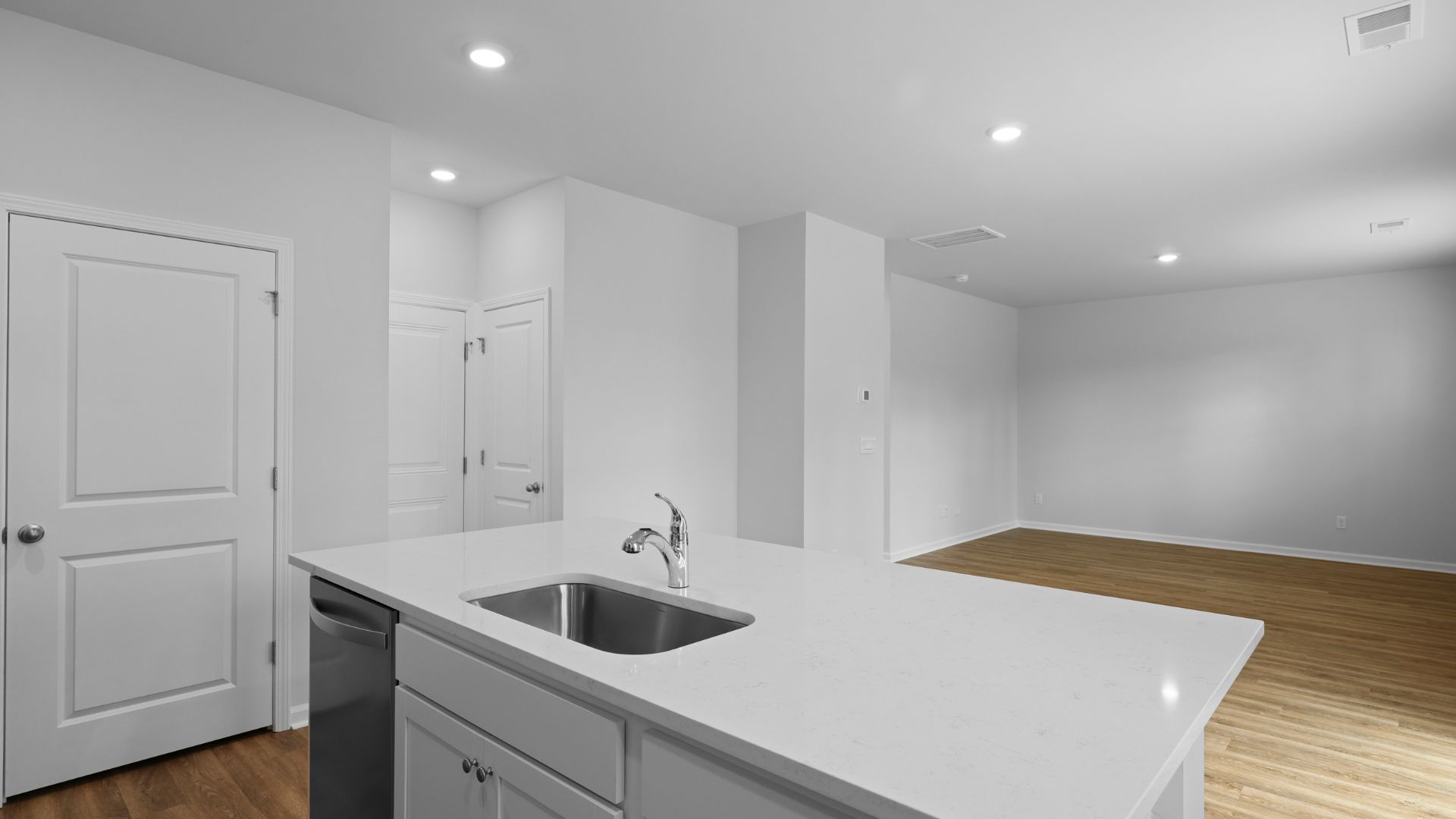 Spacious kitchen island that fits barstools underneath for extra seating