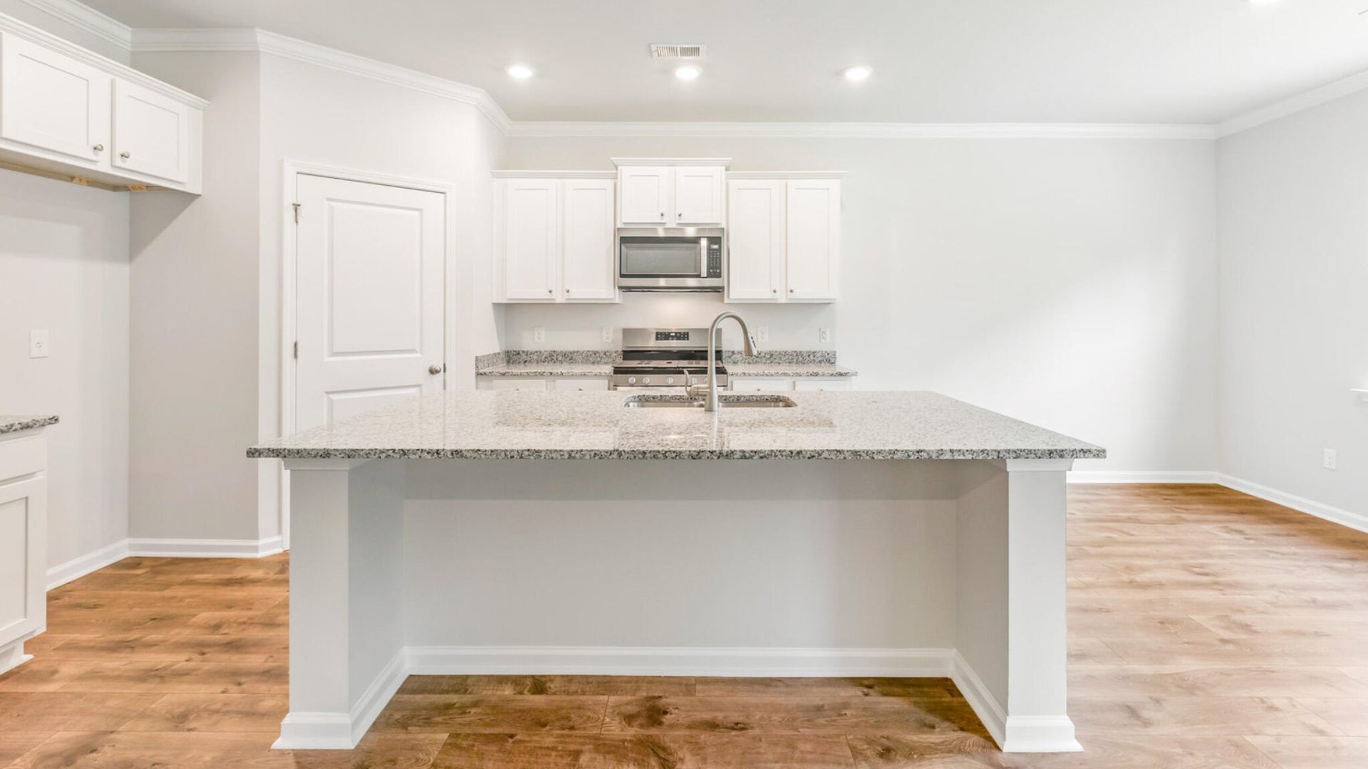 The floating kitchen island in the Dawson floorplan makes for extra counterspace and can fit barstools for extra seating.