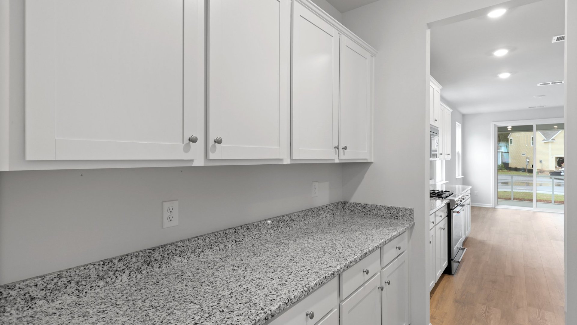 The pass-through to the dining room offers extra cabinet space as well as houses the pantry.