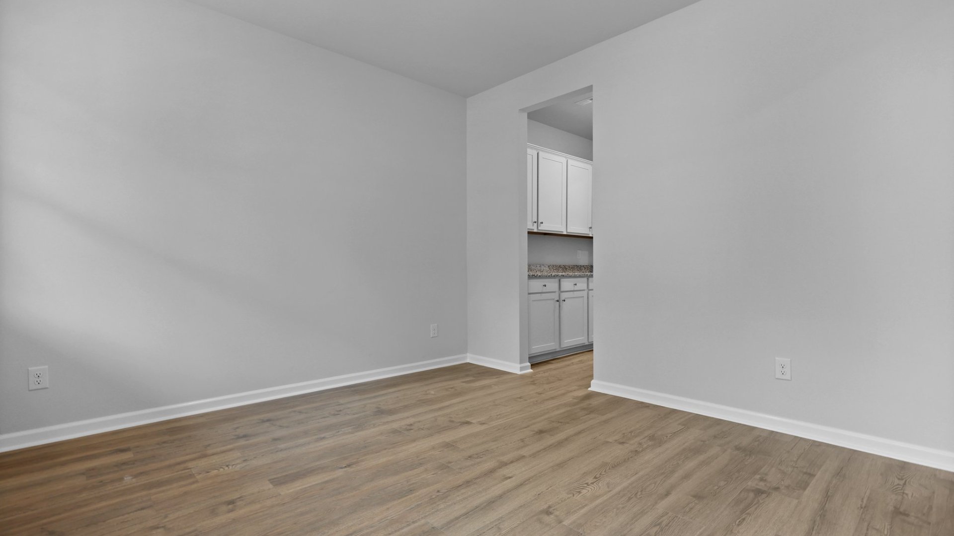 The formal dining room is spacious and well-lit.