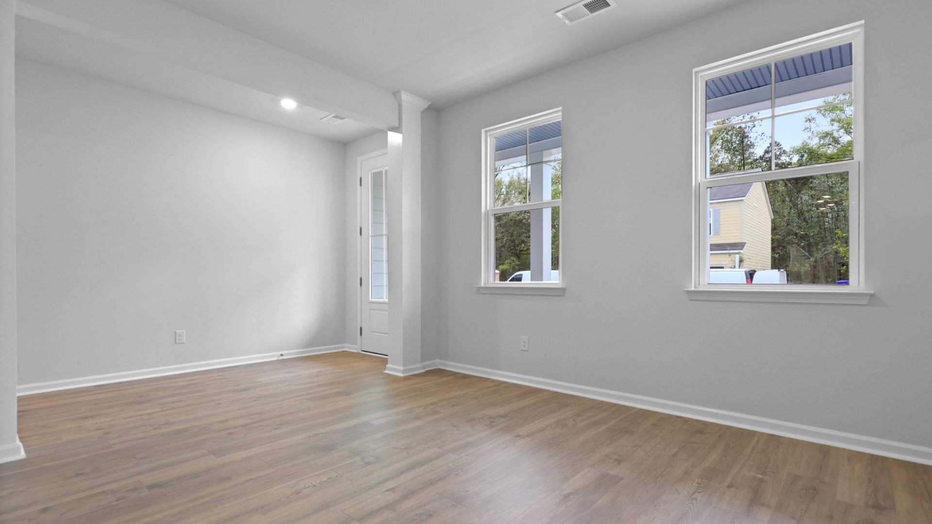 Two windows in the formal dining room make the are bright.