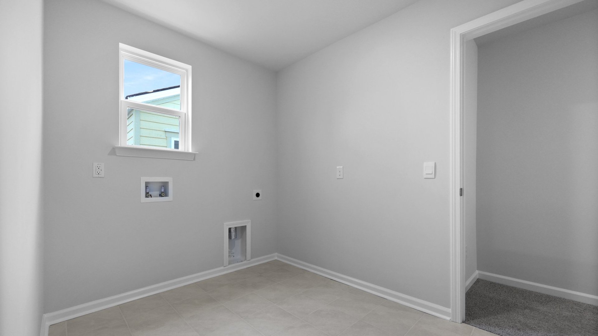 The laundry room is spacious and located upstairs.