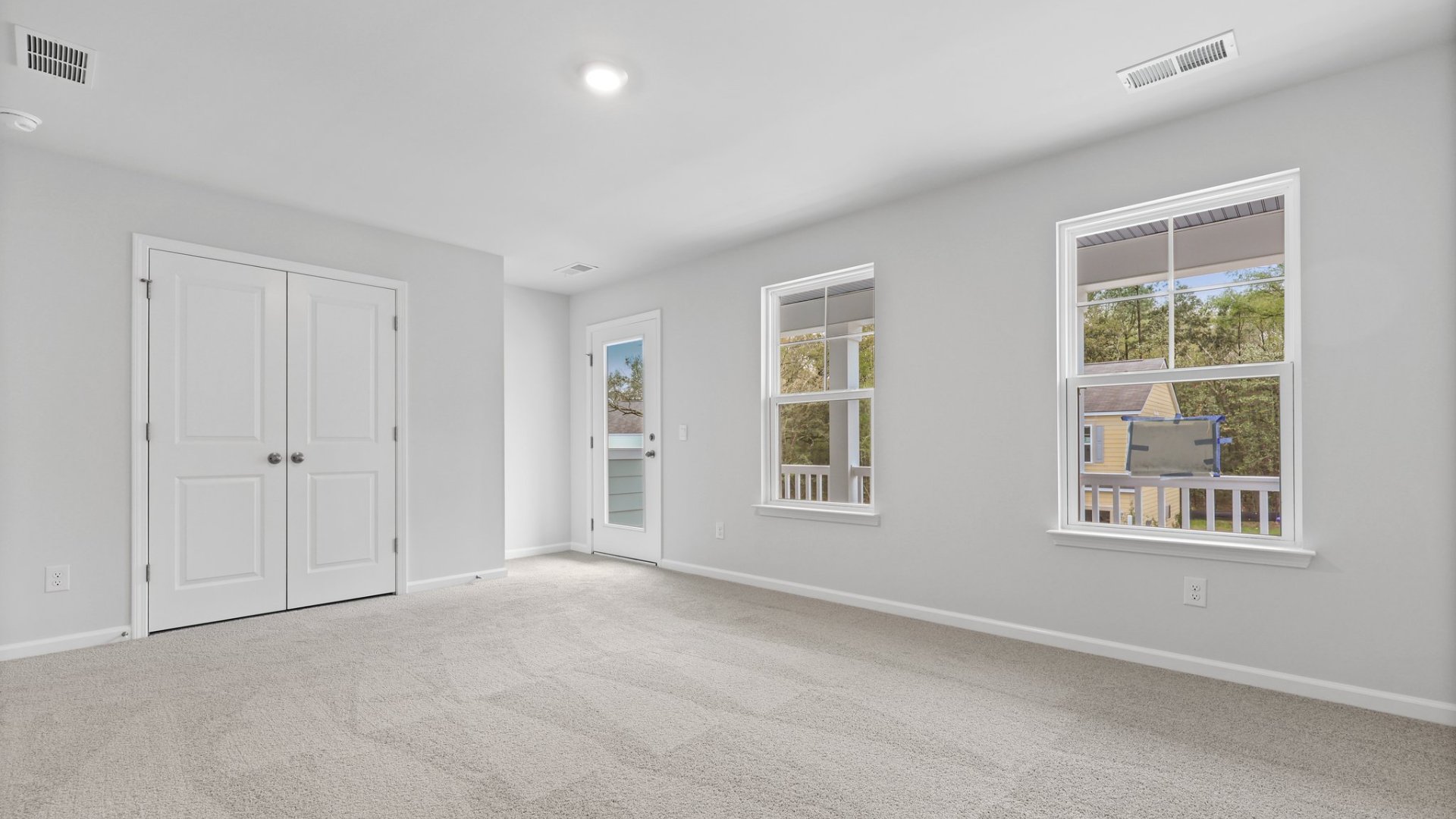 Bedroom 3 has ample natural lighting from windows and upstairs porch.