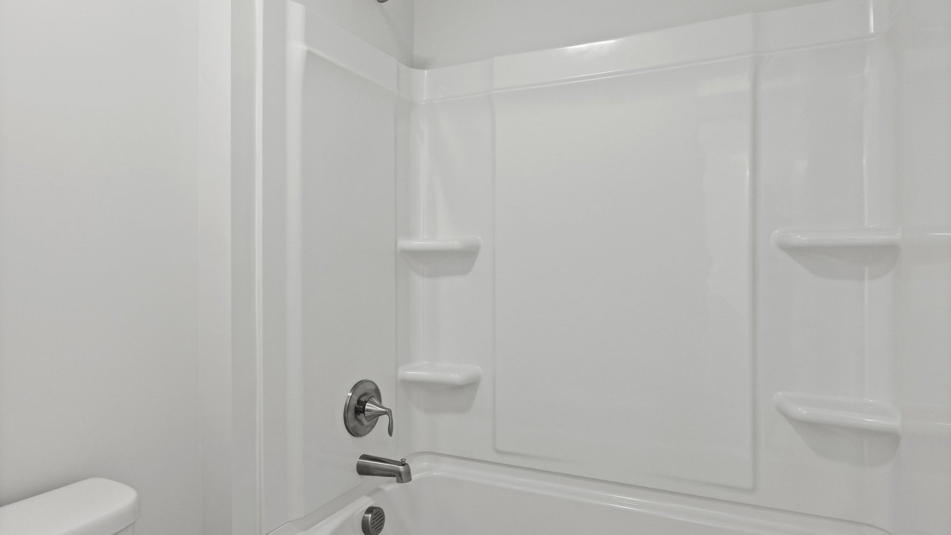 Separate room for the shower and toilet located upstairs.