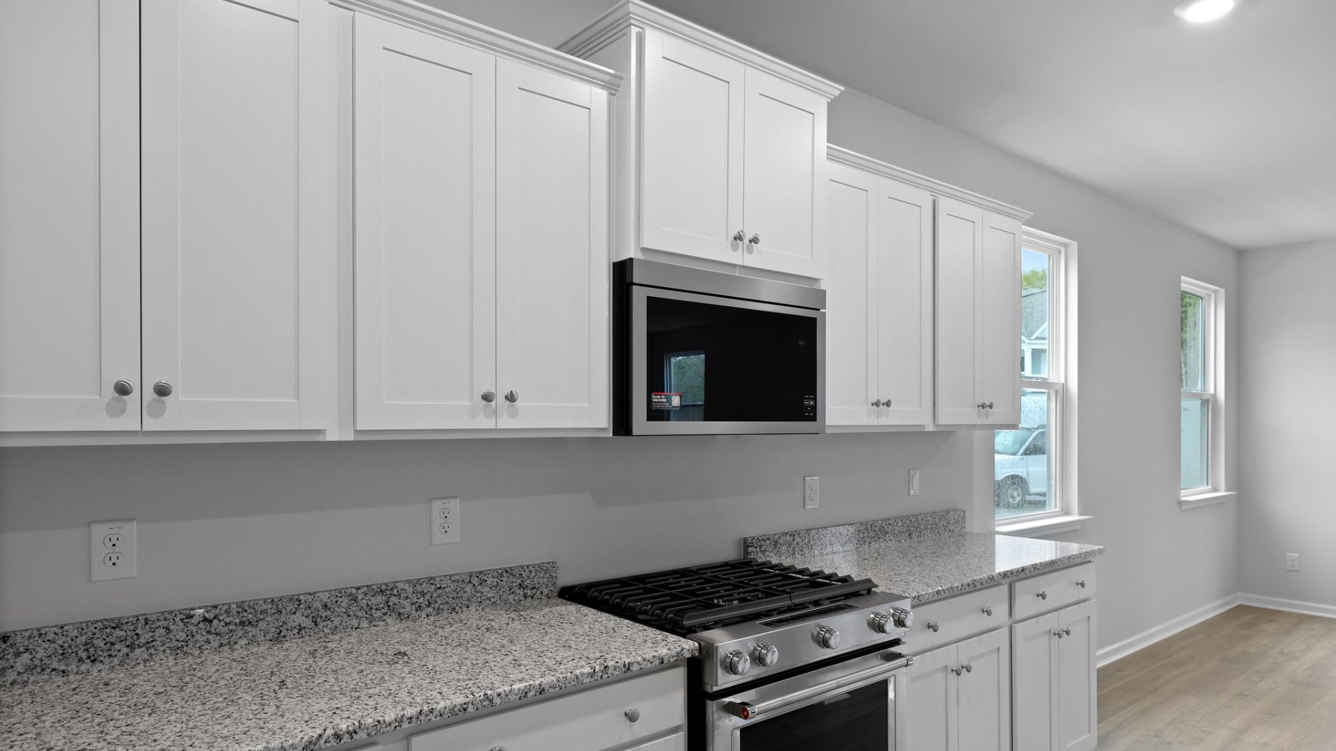 This photo features the kitchen cabinetry and stainless steel appliances in the kitchen.