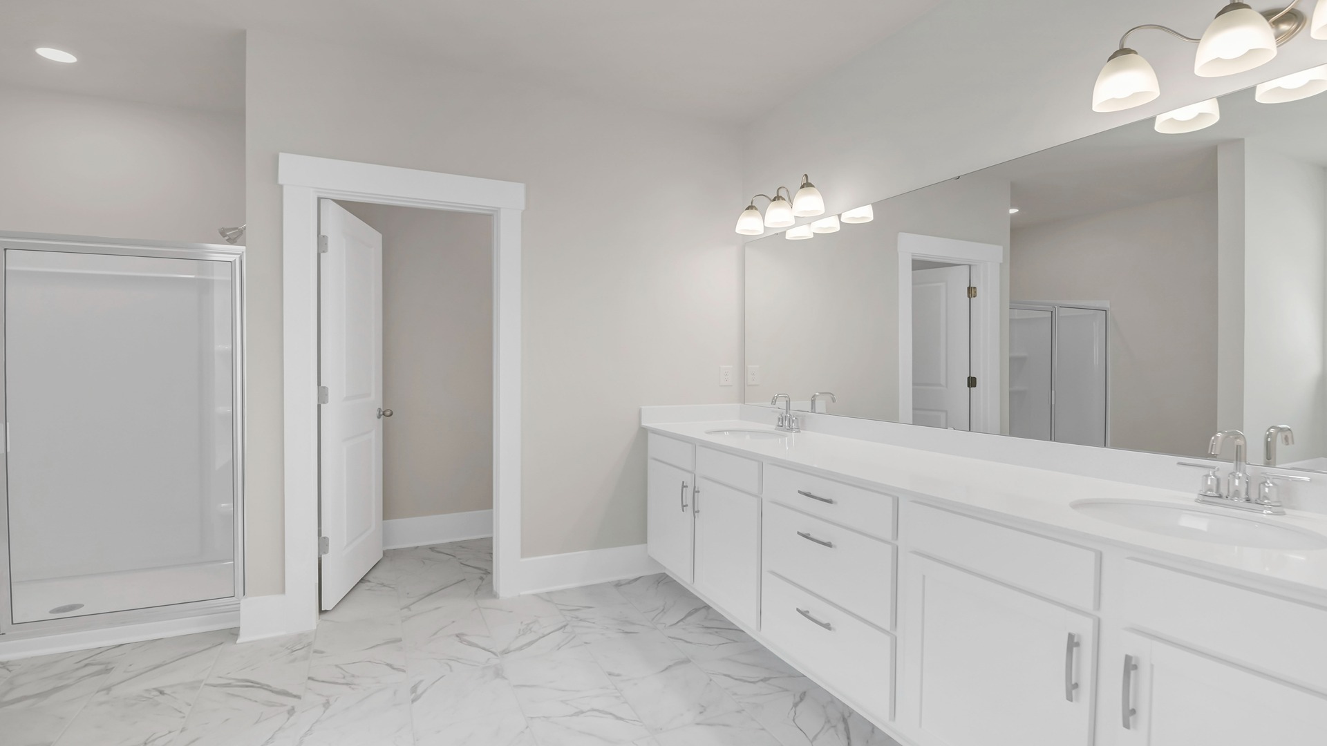 Dual vanities in the ensuite primary bathroom.